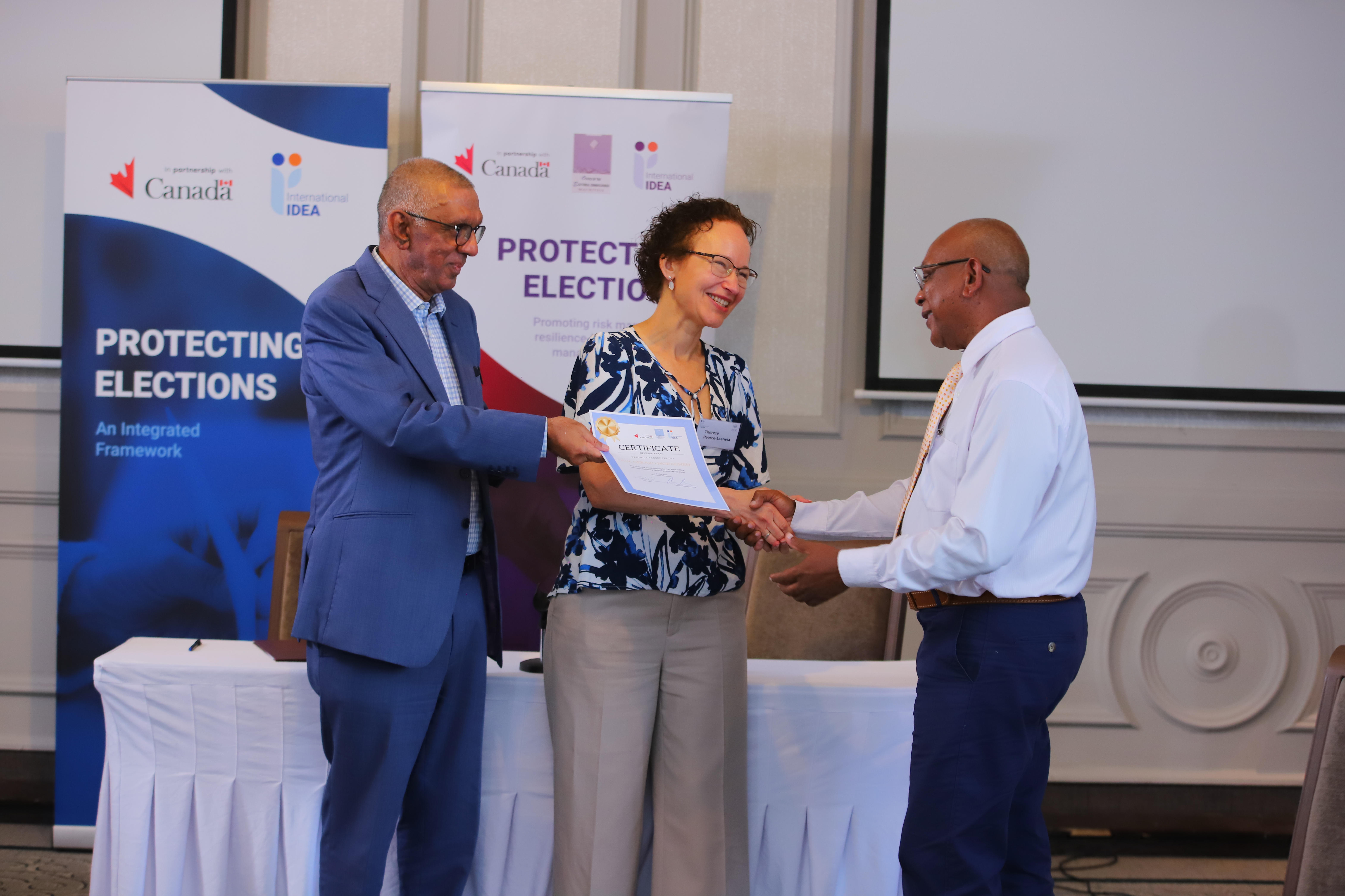 Certificates were presented by Mauritius' Election Commissioner, Mr. Rahman, and International IDEA's Head of Programme, Therese Pearce-Laanela, during the May training in Mauritius. Photo by Lume Production Company Ltd / International IDEA.