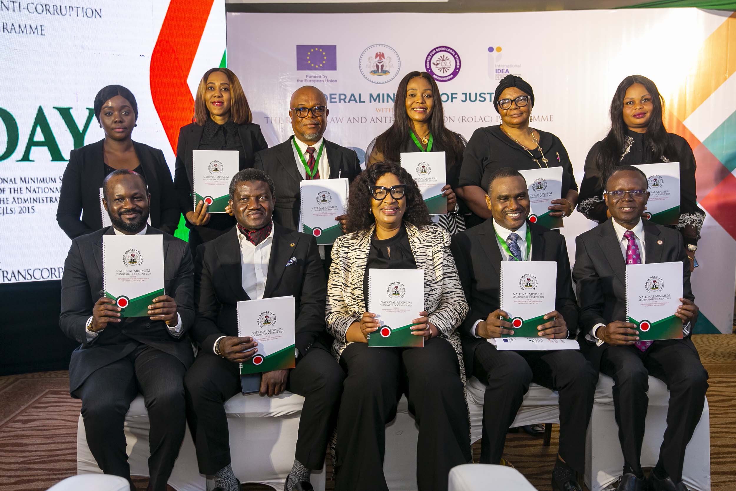 A cross section of senior members of the judiciary and the Federal Ministry of Justice Nigeria holding the just approved National Minimum Standards for the Administration of Criminal Justice Act (and Corresponding Laws). 