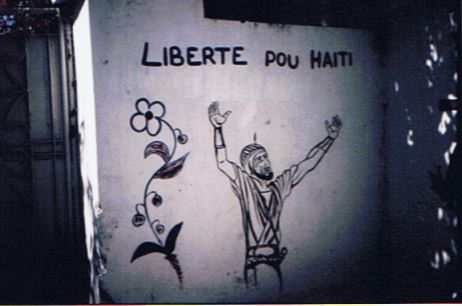 Street art of a man celebrating liberty for Haiti