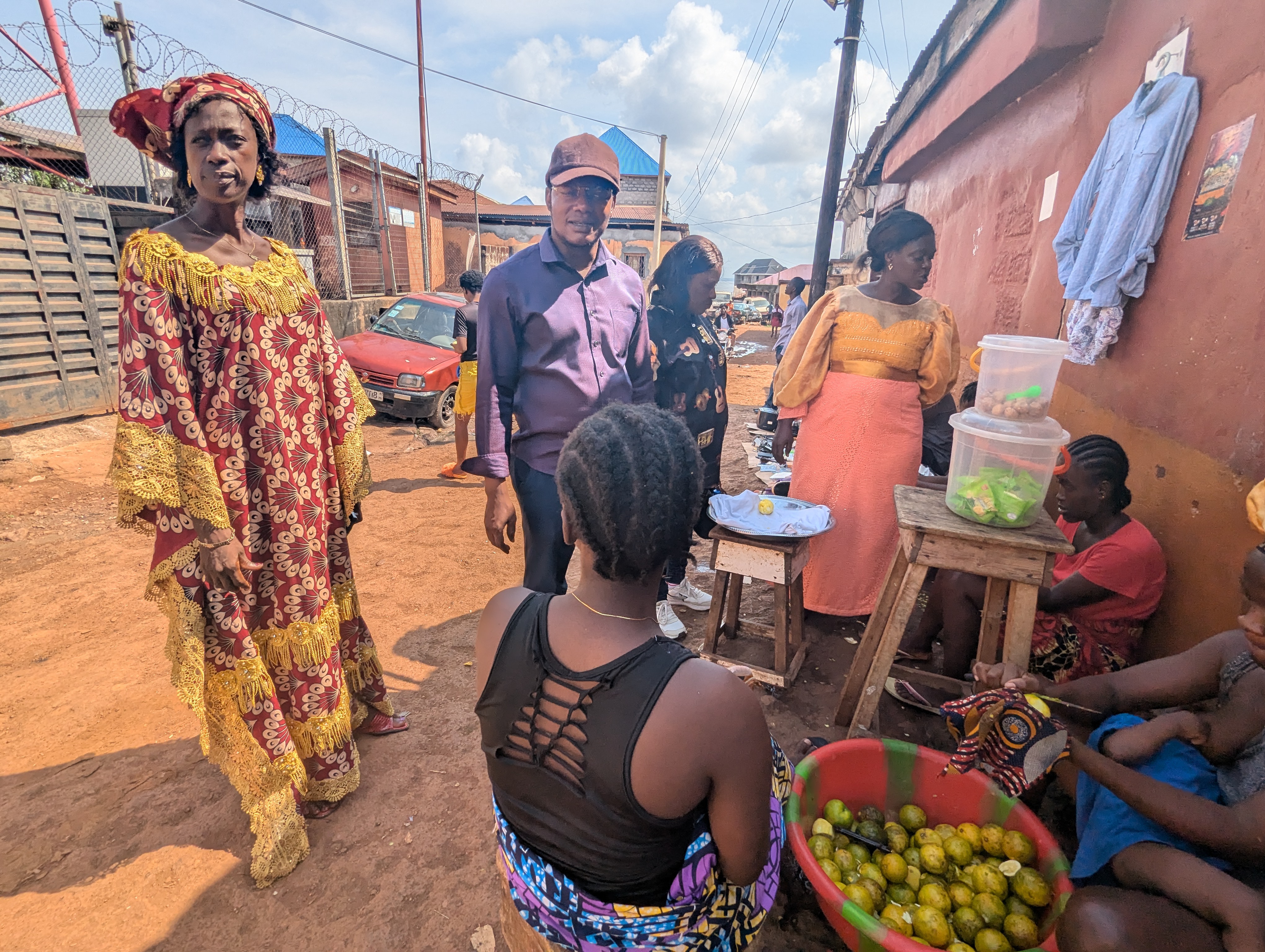 Local councilor Agnes Marah, whose district covers more than 45,000 residents in  Freetown’s Western Urban district, discusses local issues with constituents. Marah, known locally as the “iron lady” is part of an International IDEA-backed initiative, along with the 50-50 gender rights group that has trained hundreds of elected women on issues from campaigning on social media to writing grant applications.  