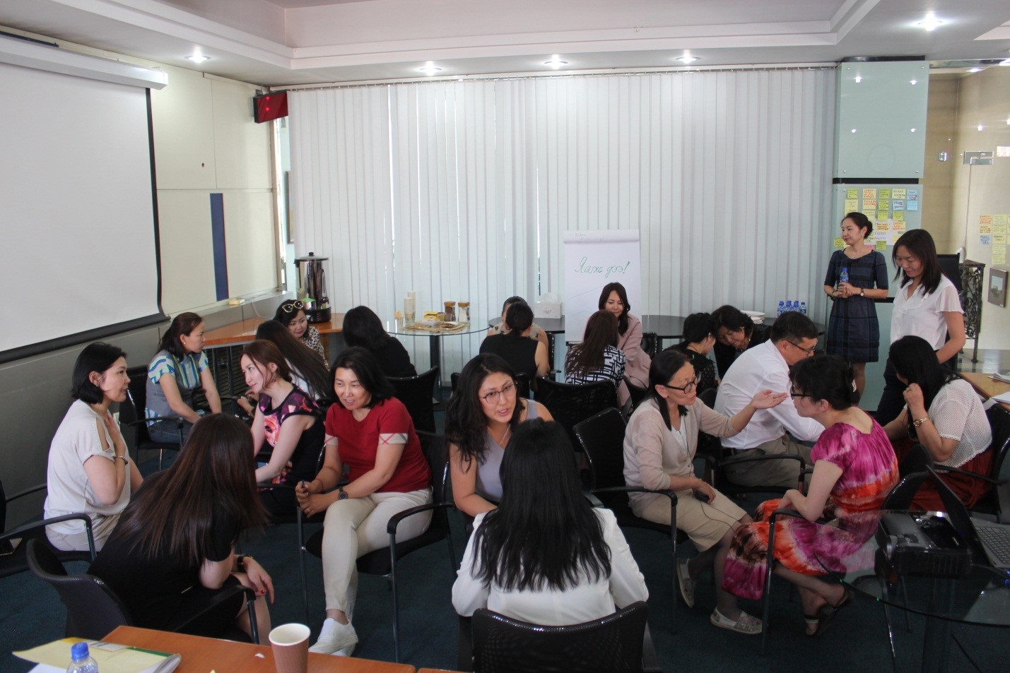 Reaching across the aisle: Women from opposing political parties sit together to discuss common challenges and ways to improve inclusiveness of political process in Mongolia in June 2018. Photo: BRIDGE workshop.