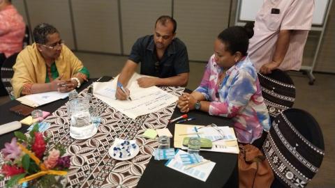 Participants involved in a group discussion.  